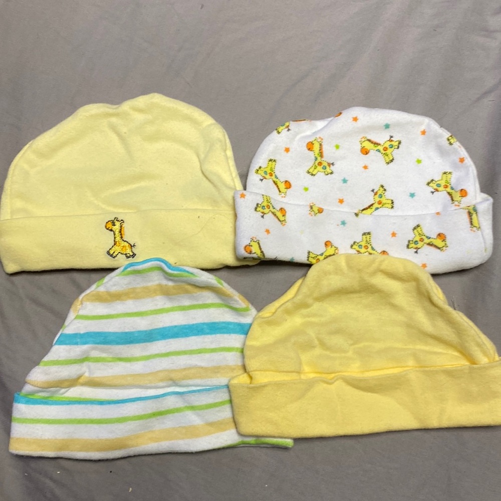 4 Newborn beanies. Soft pastel colors.